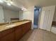 Bathroom includes double sinks, a vanity, a bathtub, and a shower at 6336 Buford St # 307, Orlando, FL 32835