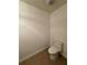 Powder bathroom featuring a toilet and neutral tile floors at 6336 Buford St # 307, Orlando, FL 32835