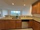Well-equipped kitchen with stainless steel appliances and granite countertops, perfect for cooking at 6336 Buford St # 307, Orlando, FL 32835