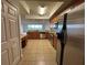Modern kitchen with stainless steel appliances, granite countertops, and an open layout connecting to the living area at 6336 Buford St # 307, Orlando, FL 32835