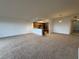 Spacious living area adjacent to a well-equipped kitchen with pendant lighting at 6336 Buford St # 307, Orlando, FL 32835