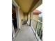 Balcony of condo with patio furniture, a railing, and views of lush greenery at 6403 Parc Corniche Dr # 4308, Orlando, FL 32821