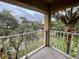 Balcony view featuring palm trees and greenery from the condo's outdoor space at 6403 Parc Corniche Dr # 4308, Orlando, FL 32821