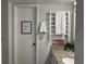 Well-lit bathroom features a heated towel rack, granite countertop and framed 'thinking room' wall art at 6403 Parc Corniche Dr # 4308, Orlando, FL 32821
