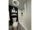 Bright, clean bathroom features a shower/tub combo and decorative green wall accent for a spa-like feel at 6403 Parc Corniche Dr # 4308, Orlando, FL 32821