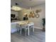 Bright dining area featuring stylish decor, a modern light fixture, and comfortable seating at 6403 Parc Corniche Dr # 4308, Orlando, FL 32821