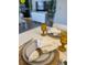 Tastefully set dining table featuring elegant glassware and tableware for sophisticated gatherings at 6403 Parc Corniche Dr # 4308, Orlando, FL 32821
