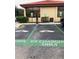 Community electric vehicle charging station with EV charging only sign at 6403 Parc Corniche Dr # 4308, Orlando, FL 32821