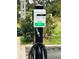 Community electric vehicle charging station with hose visible at 6403 Parc Corniche Dr # 4308, Orlando, FL 32821