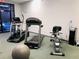 Community exercise room with treadmill, elliptical, exercise bike, and balance ball at 6403 Parc Corniche Dr # 4308, Orlando, FL 32821