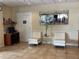 Lobby with comfortable chairs, mirror, desk, and reading nook at 6403 Parc Corniche Dr # 4308, Orlando, FL 32821