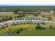 Aerial shot pinpointing the house in a neighborhood near a lake with highway access at 6728 Great Bear Dr, Lakeland, FL 33805