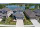 Stunning aerial view of home, showcasing its well-manicured lawn and waterfront location at 6728 Great Bear Dr, Lakeland, FL 33805
