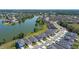 Scenic aerial view of a lakeside community with well-maintained homes and lush green landscaping at 6728 Great Bear Dr, Lakeland, FL 33805
