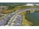 Lakeside community, aerial view with modern homes, green spaces, and waterfront scenery at 6728 Great Bear Dr, Lakeland, FL 33805