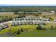 Expansive aerial view of a residential community with lakes, roadways and lush greenery at 6728 Great Bear Dr, Lakeland, FL 33805