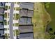 Overhead view of a suburban neighborhood with homes lining a street adjacent to a lake at 6728 Great Bear Dr, Lakeland, FL 33805
