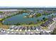 A single-Gathering home with a red outline in a lakeside community featuring attractive homes and serene water views at 6728 Great Bear Dr, Lakeland, FL 33805