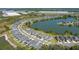 An aerial showcases a well-planned community with attractive homes alongside a tranquil lake at 6728 Great Bear Dr, Lakeland, FL 33805
