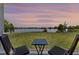 Backyard view with seating and lake at 6728 Great Bear Dr, Lakeland, FL 33805