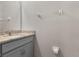 Powder room with single granite vanity and framed mirror at 6728 Great Bear Dr, Lakeland, FL 33805