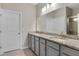 Bathroom with double vanity featuring granite counters, and white cabinets at 6728 Great Bear Dr, Lakeland, FL 33805