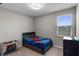 This charming bedroom is brightly lit by a window and features neutral decor at 6728 Great Bear Dr, Lakeland, FL 33805