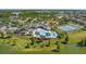 Community amenities feature a clubhouse, swimming pool, playground, and tennis courts by the lake at 6728 Great Bear Dr, Lakeland, FL 33805