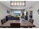 Modern dining room open to the kitchen with table seating for six and views of the lake at 6728 Great Bear Dr, Lakeland, FL 33805