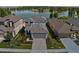 Charming two-story home with a well-manicured lawn and attached two-car garage at 6728 Great Bear Dr, Lakeland, FL 33805