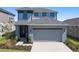Charming two-story home with a well-manicured lawn and attached two car garage in a Gathering friendly neighborhood at 6728 Great Bear Dr, Lakeland, FL 33805