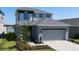 Charming two-story home with a well-manicured lawn and attached two car garage in a Gathering friendly neighborhood at 6728 Great Bear Dr, Lakeland, FL 33805