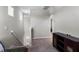 A home hallway features neutral walls and plush carpet leading to bedrooms at 6728 Great Bear Dr, Lakeland, FL 33805
