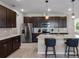 Beautiful eat-in kitchen featuring stainless steel appliances, granite countertops, and a center island at 6728 Great Bear Dr, Lakeland, FL 33805