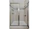 Tiled shower with glass door and built in shampoo caddy at 6728 Great Bear Dr, Lakeland, FL 33805