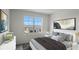 Bright bedroom featuring a large window with scenic views and neutral decor at 699 Griffon Ave, Lake Alfred, FL 33850