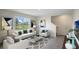 Inviting living room features stylish decor, a plush sofa, and a large window with a view of the outdoors at 699 Griffon Ave, Lake Alfred, FL 33850
