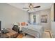 Comfortable bedroom with a well-lit window, cozy rug, and a functional workspace at 720 Lakeside Dr, Winter Springs, FL 32708