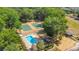 Aerial view of community pool, tennis courts, playground, and green spaces at 720 Lakeside Dr, Winter Springs, FL 32708