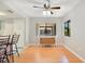 Inviting dining area featuring a ceiling fan, with a table and access to the living room and kitchen at 720 Lakeside Dr, Winter Springs, FL 32708