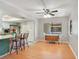 Inviting dining area featuring a ceiling fan, with a table and access to the living room and kitchen at 720 Lakeside Dr, Winter Springs, FL 32708