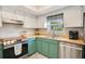 The kitchen features stainless steel appliances and sleek wooden countertops at 720 Lakeside Dr, Winter Springs, FL 32708