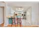 Cozy kitchen featuring a breakfast bar with seating and updated stainless steel appliances at 720 Lakeside Dr, Winter Springs, FL 32708