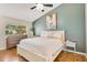 Spacious main bedroom with a large window, accent wall, and modern decor at 720 Lakeside Dr, Winter Springs, FL 32708
