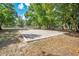 Outdoor sand volleyball court surrounded by mature trees, ideal for recreation at 720 Lakeside Dr, Winter Springs, FL 32708