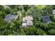 Aerial view showing a home with a pool and extensive foliage surrounded by other residences at 725 Bear Creek Cir, Winter Springs, FL 32708