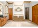 Bathroom with a large soaking tub, step-up platform and glass shower at 725 Bear Creek Cir, Winter Springs, FL 32708