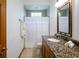 Bathroom featuring a granite countertop vanity and tiled shower at 725 Bear Creek Cir, Winter Springs, FL 32708