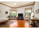 A bright bedroom features wood floors, bay windows, and a desk and mirror at 725 Bear Creek Cir, Winter Springs, FL 32708