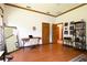 This bedroom is naturally lit and offers wood floors and trim, desk space, and dual closets at 725 Bear Creek Cir, Winter Springs, FL 32708